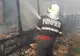 Incendiu stins de pompieri în Roman. Două persoane, evacuate
